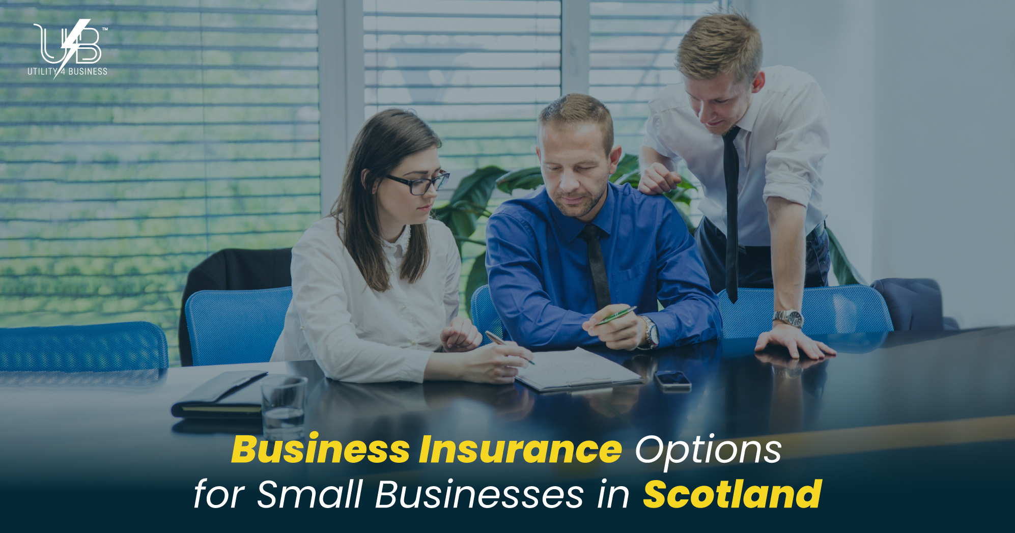 Business Insurance Scotland – Small business owners discussing insurance options and coverage plans in office meeting.